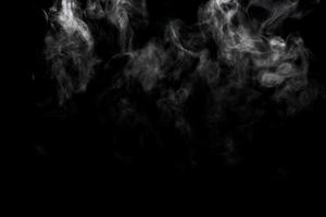 Abstract powder or smoke effect isolated on black background photo