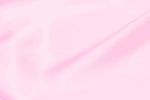 Plastic pink satin fabric texture soft blur background photo