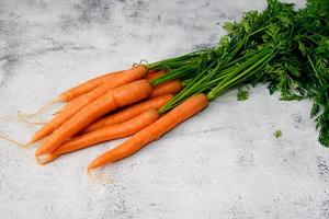 Carrots on a rustic table photo