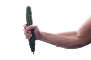 Raw food man holding vegetables and fruit photo