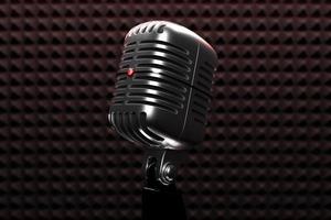 Silver  retro microphone isolated on a dark background. minimal style. 3d rendering photo