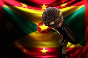 Microphone on the background of the National Flag of Grenada, realistic 3d illustration. music award, karaoke, radio and recording studio sound equipment photo