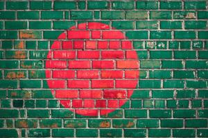 Bangladeshi flag flag on a grunge brick background. photo