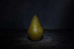 Delicious pear on a rustic background photo