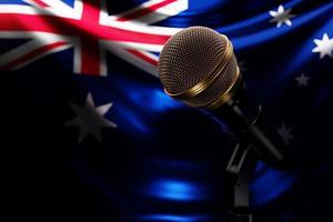 Microphone on the background of the National Flag of Australia, realistic 3d illustration. music award, karaoke, radio and recording studio sound equipment photo