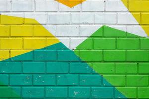 Colorful  brick wall of an old building, background texture of a brick photo