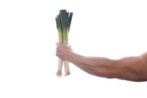 Raw food man holding vegetables and fruit photo