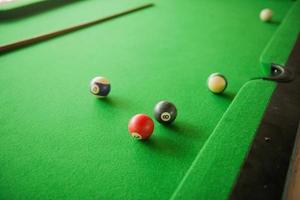 Billard balls on green billard table photo