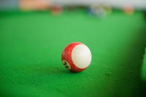 Billard balls on green billard table photo