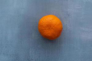 Delicious clementines on rustic background photo