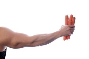 Raw food man holding vegetables and fruit photo