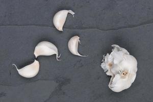 Garlics on granite table photo