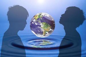 world concept and resources Water, water management. globe floating on water photo
