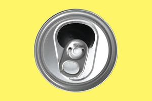 Top view of a opened soft drink can,The opened cans of soft drinks are made of aluminum and have light on the shiny surface on isolate. photo