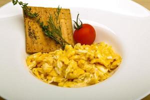 Scrambled eggs with tomato photo