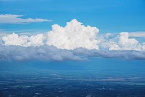 Fantastic soft white clouds against blue sky background photo