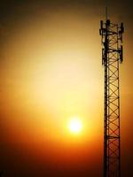 Telephone towers used to broadcast signals at dusk. photo