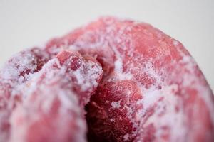 Texture of frozen fresh raw meat, close up, macro photo