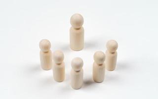 Wooden peg dolls on white background. Teamwork, Leadership, Business, human resource management Concept photo