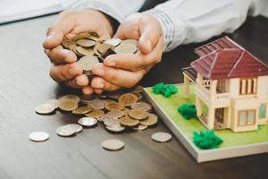 House model with money coins photo