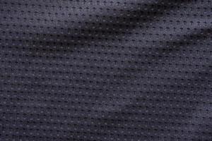 Black fabric sport clothing football jersey texture background photo