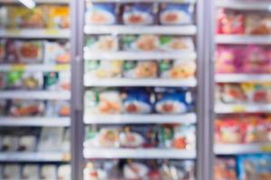 supermarket refrigerator for storage frozen food product in grocery store photo