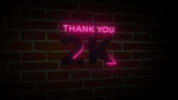 grazie 2k seguaci realistico segno di bagliore al neon sull'animazione del muro di mattoni video