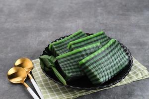 Kue Lapis Pandan or Kue Pepe or sticky layer cake, Indonesian traditional snack made from rice flour photo