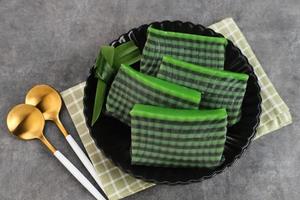 Kue Lapis Pandan or Kue Pepe or sticky layer cake, Indonesian traditional snack made from rice flour photo