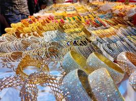 Colorful bangles from a shop in Bangladesh, Background of colorful bangles stacked with glitter and plain colored bangles, shining Colorful bangles photo