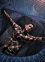 Entangled - a man spreads his arm in a net photo