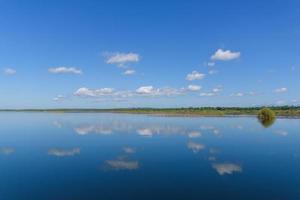 Large island in the lake. There is a beautiful cloud reflecting on the water At  Bueng Kan Province of Thailand 3 photo