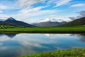 Picturesque landscape with green nature in Iceland during summer. Image with a very quiet and innocent nature. photo