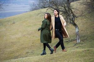 Beautiful sensual portrait of young stylish couple in love.Image of adorable brunette couple in love. Happy family. photo
