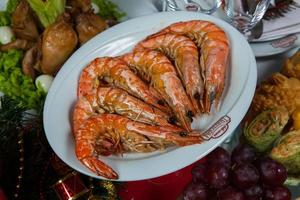 Beautiful festive table served for wedding celebration dinner at home or restaurant interior. Table full of food at a restaurant. Full round table. photo