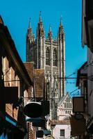 Juxtaposition view of Gothic Canterbury Cathedral, one of the oldest and most important Christian sites in England photo