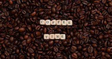 the word coffee time in the center of a lot of coffee beans photo