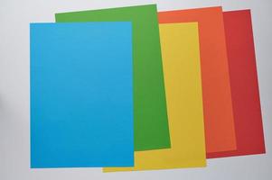 colorful five papers lying on top of each other, background photo with copy space for any text