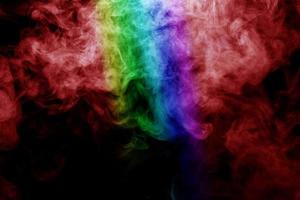 Abstract smoke isolated on black background,Rainbow powder photo