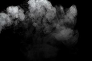 Abstract powder or smoke effect isolated on black background photo