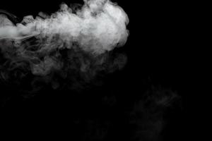 Abstract powder or smoke effect isolated on black background photo