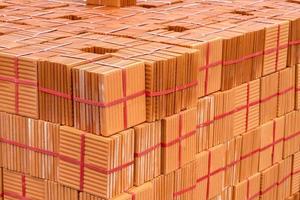 Stack of brown tiles at the constructing site photo