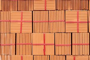 Stack of brown tiles at the constructing site photo