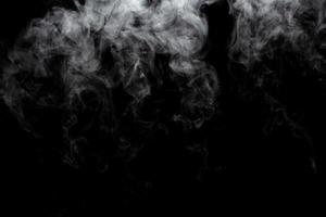 Abstract powder or smoke effect isolated on black background photo