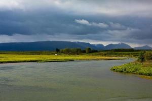 Picturesque landscape with green nature in Iceland during summer. Image with a very quiet and innocent nature. photo