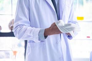 The scientist biologist or researcher putting personal protective equipment to prevent infection from virus or bacteria disease. photo