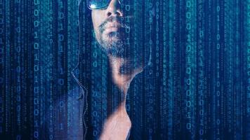 The concept of hackers and insecurity in networking. Dishonest hood man or data thieves photo