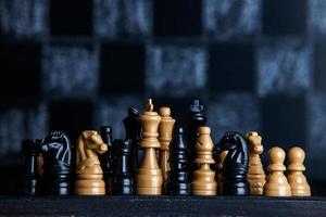 Chess board with chess pieces. Chess on the dark background. Business success concept. Strategy. Checkmate. photo
