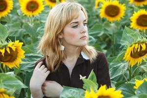 Portrait of russian schoolgirl in the sunflower field photo