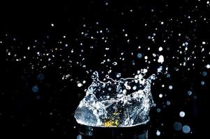 Abstract background of Water splashing on a black background. idea for freshness photo